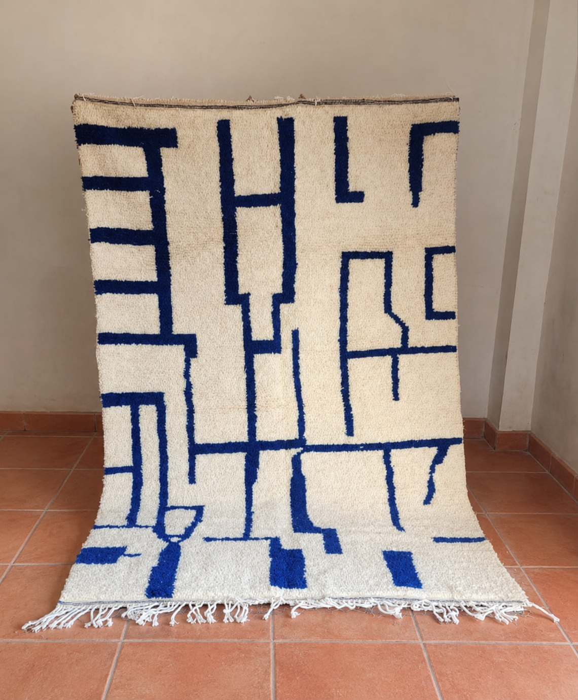 Moroccan rug — hand-woven undyed wool with cobalt blue, High Atlas