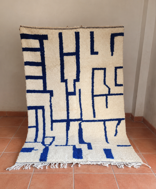 Moroccan rug — hand-woven undyed wool with cobalt blue, High Atlas